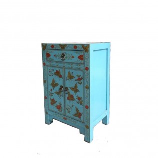 Blue bedside table with decorations